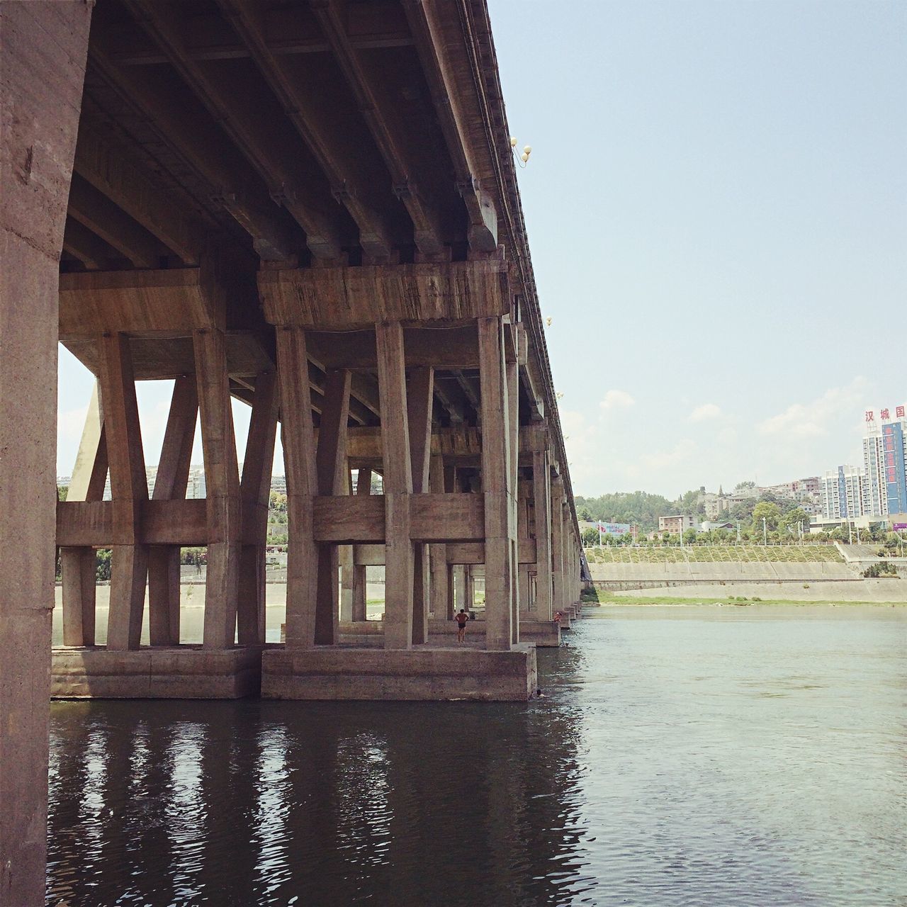 architecture, built structure, water, waterfront, bridge - man made structure, river, arch, sky, bridge, arch bridge, travel destinations, architectural column, day, rippled, no people, tourism, outdoors, engineering, capital cities, column, nature, canal, cloud - sky