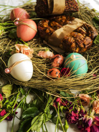 High angle view of easter eggs with decoration in nest