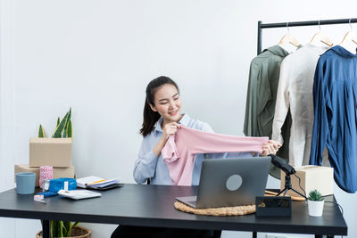 Young woman using laptop on table