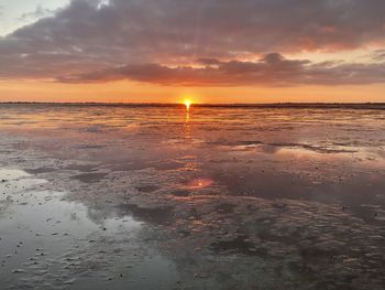 Scenic view of sea against sky during sunset