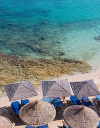 High angle view of chairs on beach