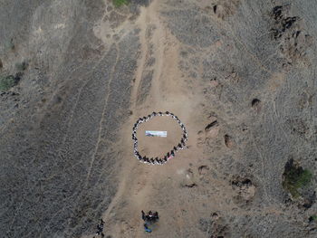 High angle view of text on sand