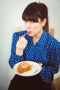 Young woman with chocolate cake