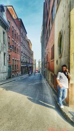 Man standing in front of buildings