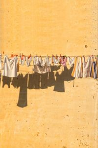 Clothes drying against wall