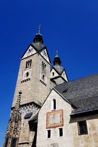 Low angle view of building against clear blue sky