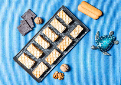 High angle view of breakfast on table against blue background