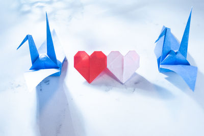 Close-up of paper flags against white background