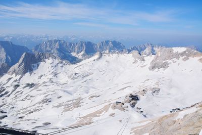 Scenic view of snowcapped mountains against sky