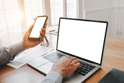 Man using laptop on table