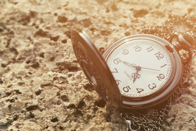 Close-up of clock on table