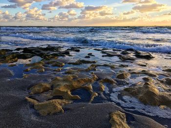 Scenic view of sea against sky at sunset