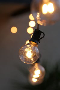 Close-up of illuminated light bulb
