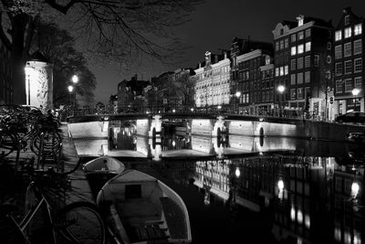 Reflection of illuminated buildings in water at night