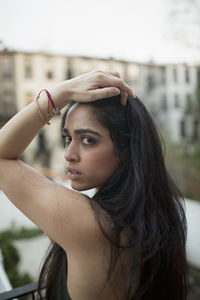 Portrait of beautiful woman standing outdoors
