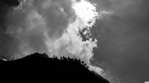 Low angle view of silhouette mountain against sky