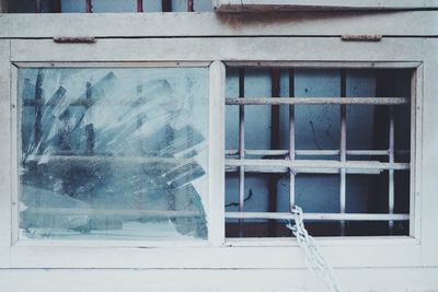 Broken glass window of old building