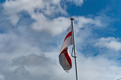 Low angle view of flag against sky