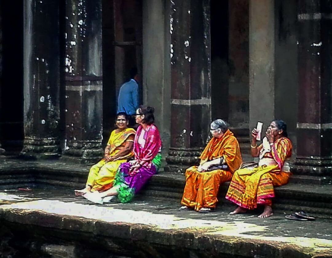 REAR VIEW OF A BUDDHA SITTING ON TEMPLE OUTSIDE CATHEDRAL