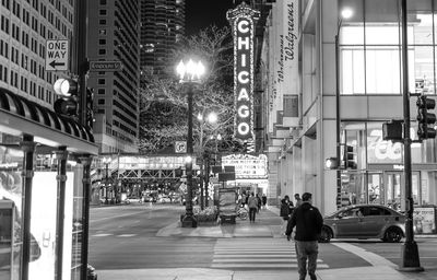 People walking on street in city