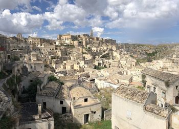 High angle view of buildings in town against sky, matera italy 