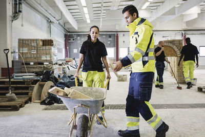 Carpentry students and teacher working at site