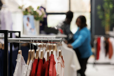 Close-up of clothes hanging in store