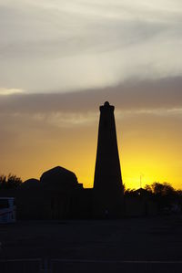 Silhouette of monument at sunset