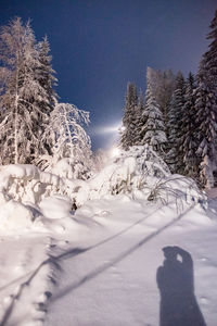 Scenic view of snow covered mountains against sky