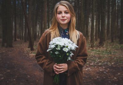 Portrait of girl holding flower