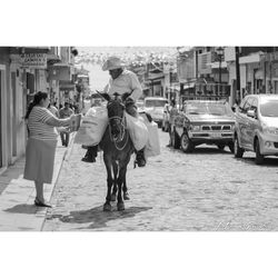 People walking on street in city