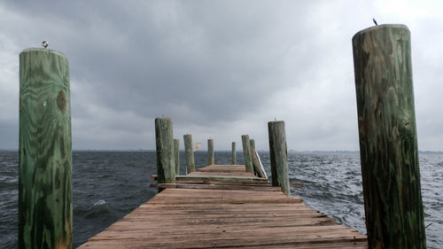Pier over sea against sky
