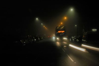 Cars on road at night