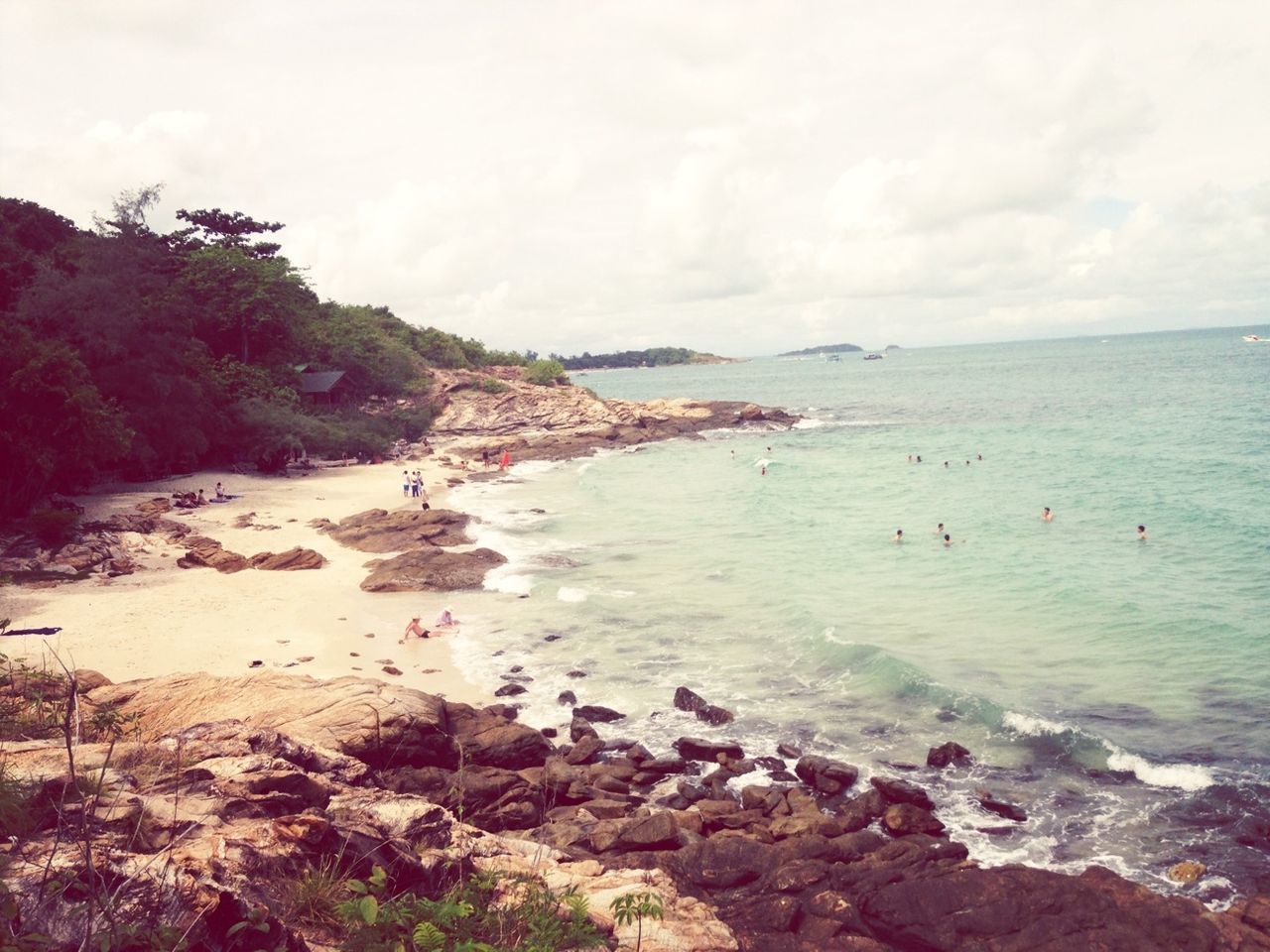 water, sea, sky, scenics, tranquil scene, beach, tranquility, beauty in nature, nature, rock - object, shore, cloud - sky, tree, horizon over water, idyllic, incidental people, day, coastline, mountain, non-urban scene