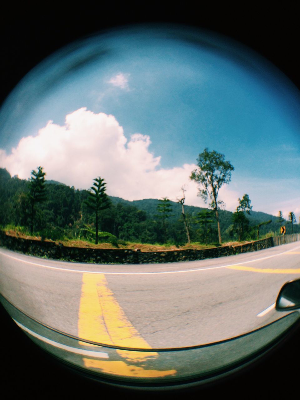 transportation, sky, road, tree, car, mode of transport, cloud - sky, road marking, land vehicle, cloud, street, vehicle interior, windshield, glass - material, cloudy, transparent, nature, travel, outdoors, no people