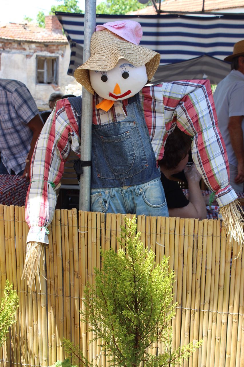 fence, outdoors, wood - material, picket fence, building exterior, day, architecture, scarecrow, no people