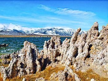 Panoramic view of snowcapped mountains against sky