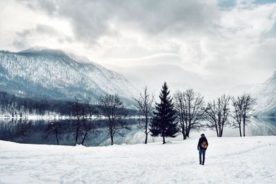 Full length of man on snow field against sky