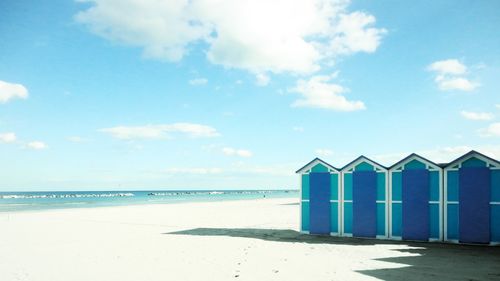 Beach huts during sunny day