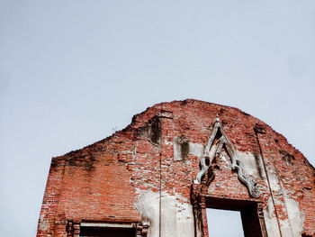 Low angle view of old building against clear sky