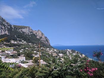 Scenic view of sea and buildings against sky