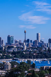 View of cityscape against blue sky