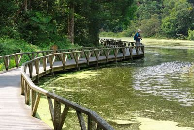 Photographer by pond