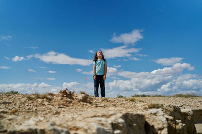 Full length of man standing on land against sky