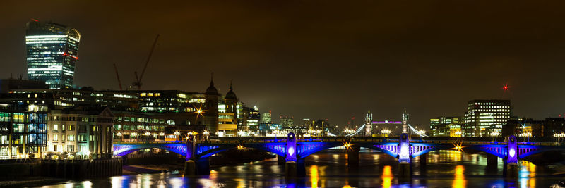 Illuminated buildings in city at night