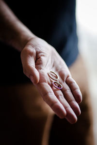 Close-up of hand with wedding rings