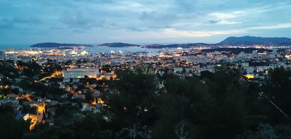 High angle view of illuminated buildings in city against sky