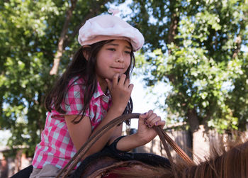 South american girl riding horse