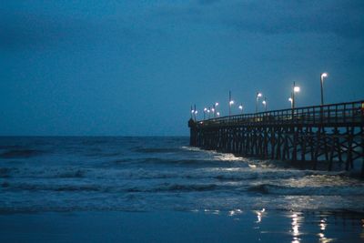 Scenic view of sea against clear sky at night