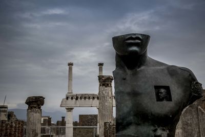 Low angle view of cemetery against sky